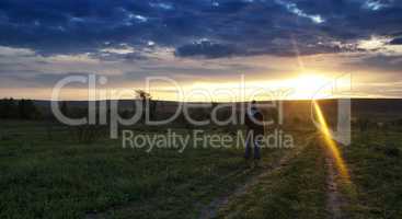 Horizontal girl meeting sunrise landscape backdrop