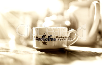Morning sepia coffee with light leak bokeh background