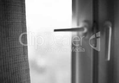 Black and white window curtain with light leak bokeh background