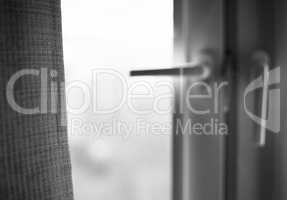 Black and white window curtain with light leak bokeh background