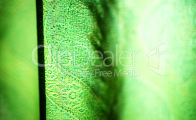 Horizontal vivid green curtain bokeh background