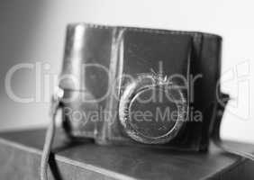 Black and white vintage camera case bokeh background