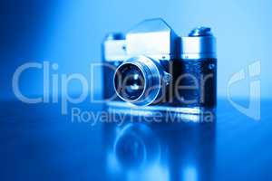 Horizontal vintage blue rangefinder camera background