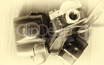 Horizontal vintage three cameras bokeh background