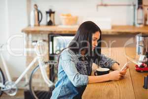 Woman using mobile phone at office