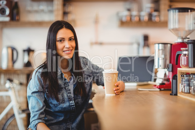 Portrait of woman having coffee