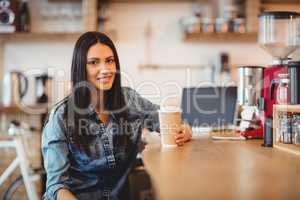 Portrait of woman having coffee