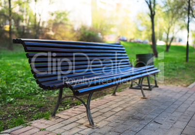 Diagonal park bench bokeh background with light leak