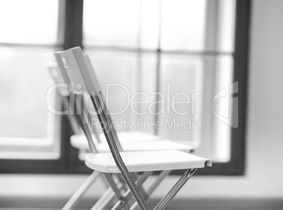 Horizontal black and white office chair bokeh background