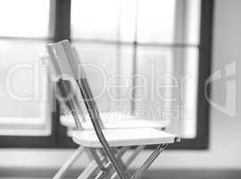 Horizontal black and white office chair bokeh background