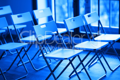 Horizontal blue office chairs bokeh background