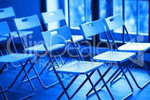 Horizontal blue office chairs bokeh background