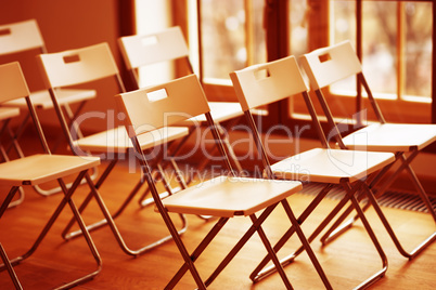 Horizontal orange office chairs bokeh background