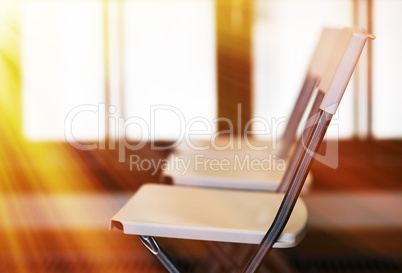 Horizontal office chairs with light leak bokeh background