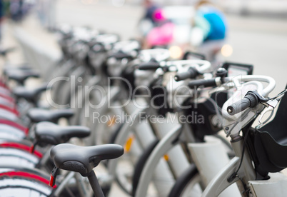 Diagonal bicycle row in street bokeh background