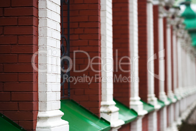 Vertical Russian temple red brick fence background
