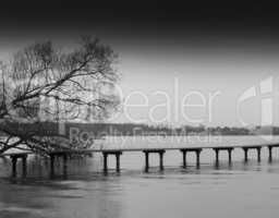 Horizontal bright black and white bridge on river background bac