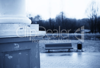 Horizontal vintage bluish bench in park bokeh background