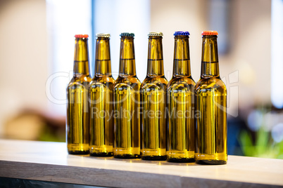 Arranged beer bottles on the bar counter