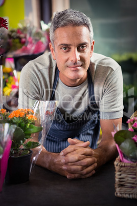 Portrait of happy male florist