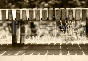 Horizontal sepia park bench bokeh background