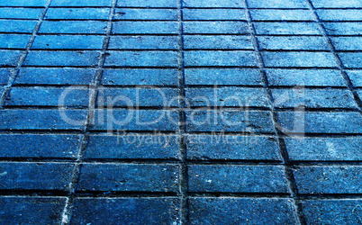 Horizontal blueish street brick texture background backdrop