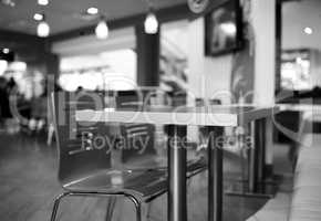 Black and white table in cafe bokeh background