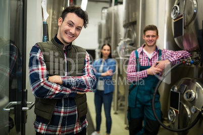 Brewers posing at brewery factory