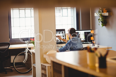 Graphic designer working at his desk