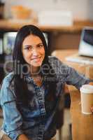 Portrait of woman having coffee