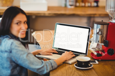 Woman using laptop at office