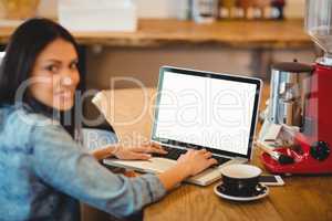 Woman using laptop at office