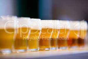 Close-up of beer glasses on the counter