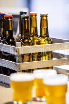Close-up of beer bottles in crate