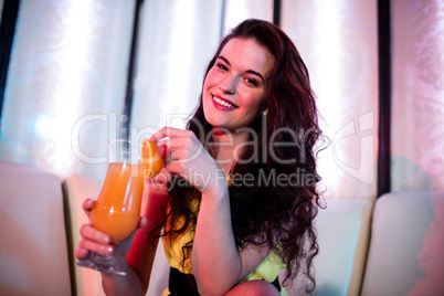Beautiful woman holding juice glass