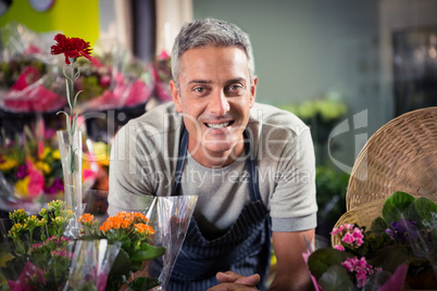 Portrait of happy male florist