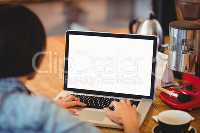 Woman using laptop at office