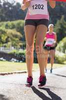 Female athlete standing on running track