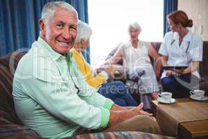 Portrait of a smiling retired man looking at the camera