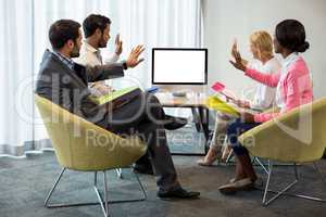 Business people looking at a screen during a video conference