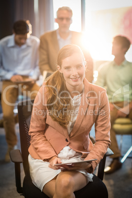 Businesswoman holding digital tablet