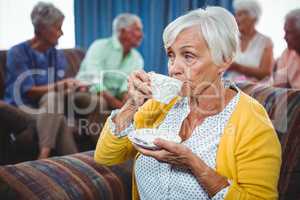 Senior woman drinking a cup of coffee