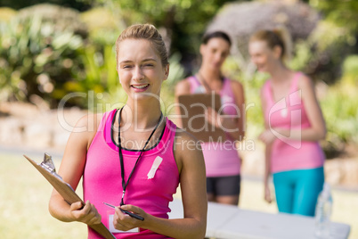 Female volunteer standing in park