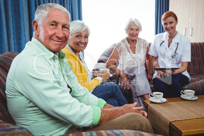 Portrait of smiling retired person looking at the camera