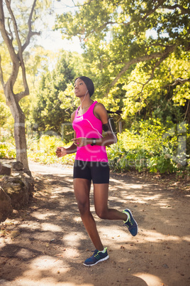 Sporty woman running alone