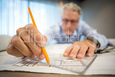 Man working on blueprint