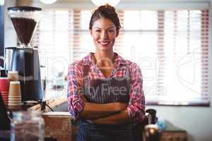 Waitress standing with arms crossed