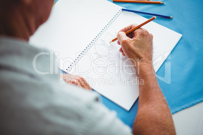 Close-up of hands writing on white paper