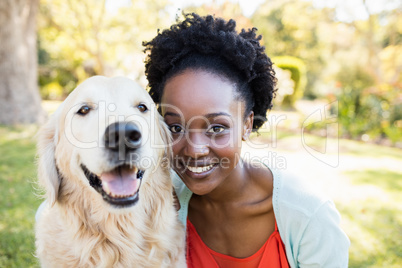 Woman posing with a dog