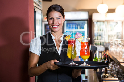 Waitress holding cocktails